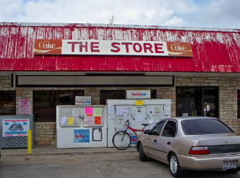 Front of worn down convenience store