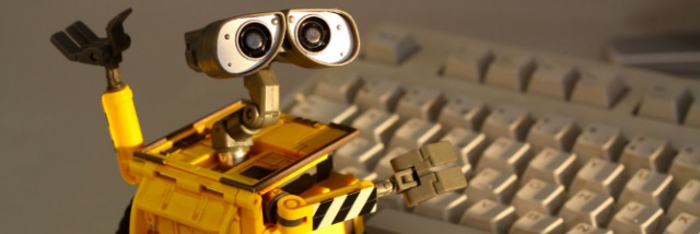 Wall-E in front of a keyboard
