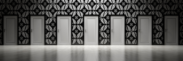 7 white doors with X patterns on wall